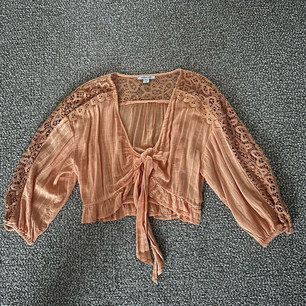 Light orange American Eagle with lace sleeves and tie front detail